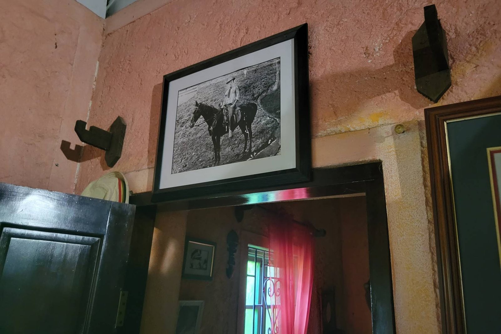 Bob Marley's dad on a horse.